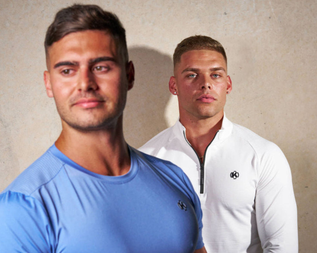 Two male models wearing Knakrd men’s activewear shirts in blue and white – festival gymwear
